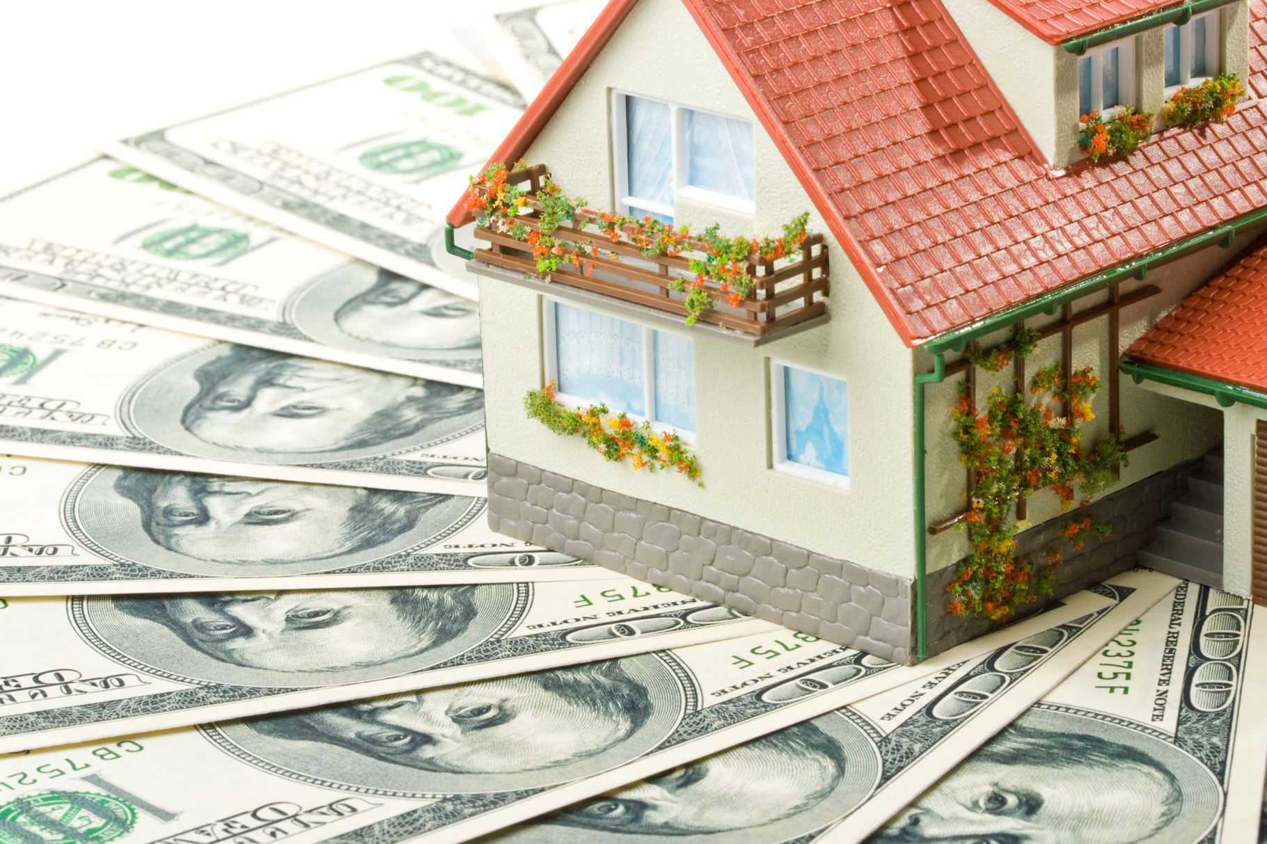 Miniature House and Money. Buying house concept
